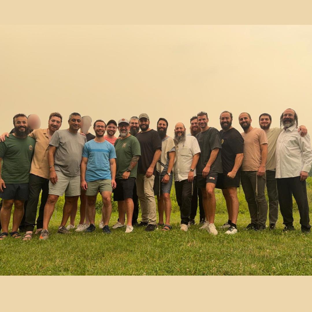 Ahdama group standing together in a field